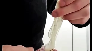 Play roughly used cumfilled condom from stranger