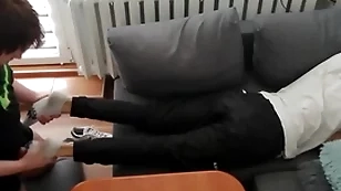 Young guy pays out his bills there his feet