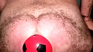 World record 13 cm on every side anal distension surrounding inflatable ball.