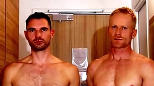 Handsome blonde fitness trainer serviced by a huge dick guy.